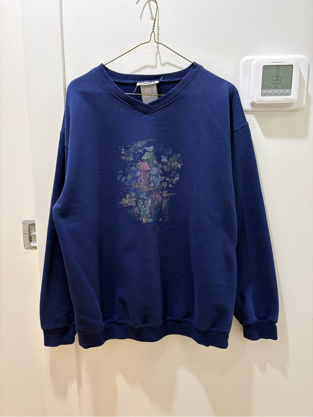 NORTHERN REFLECTIONS | Vintage Blue V-Neck Sweater with Garden Graphic